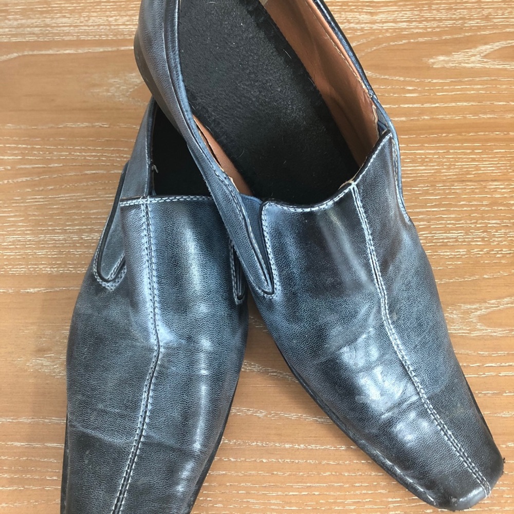 Men’s slip on shoes.  They are a blue/grey color